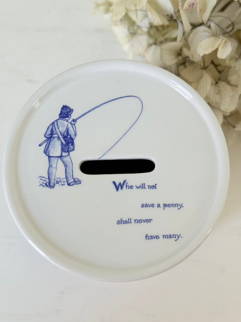 blue and white spode moneybox with sporting scene design, photographed on white surface
