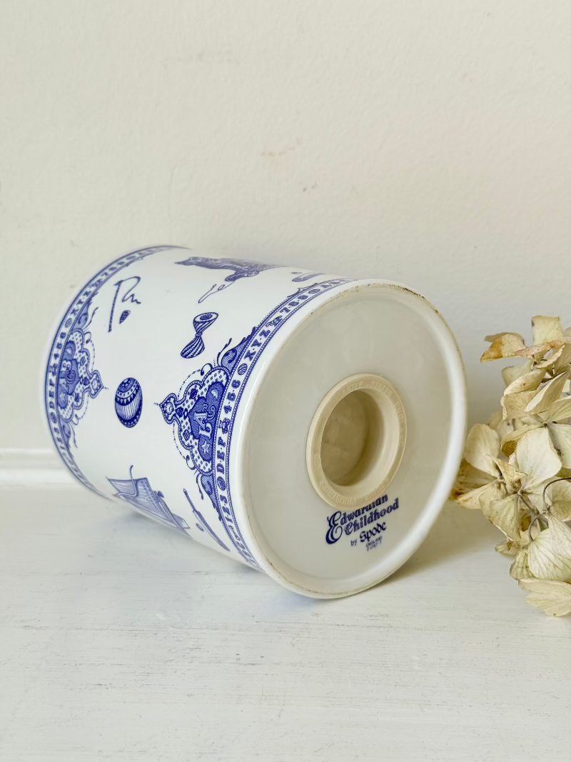 blue and white spode moneybox with sporting scene design, photographed on white surface