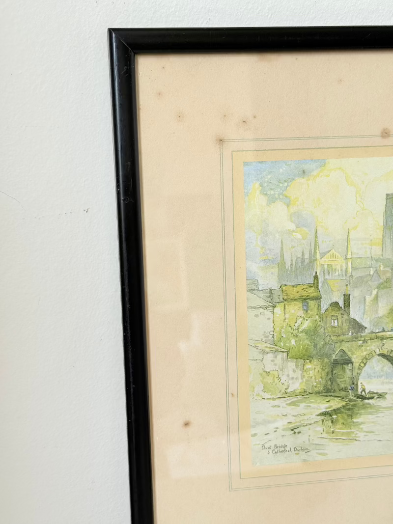 framed print of durham cathedral and elvet bridge with soft green and yellow tones photographed on white surface