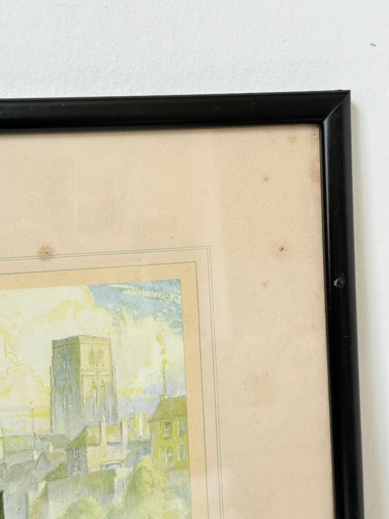 framed print of durham cathedral and elvet bridge with soft green and yellow tones photographed on white surface