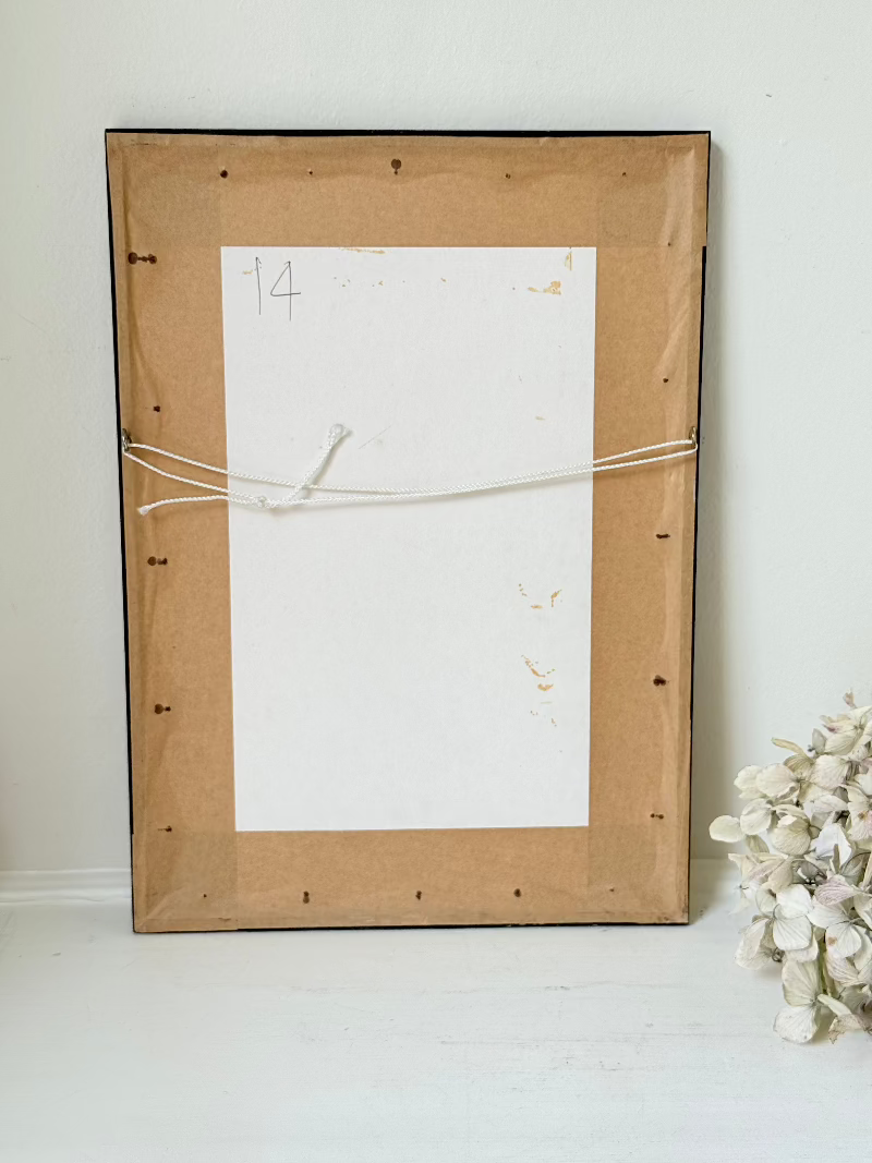 framed print of york minster and city walls in black frame, photographed on white surface