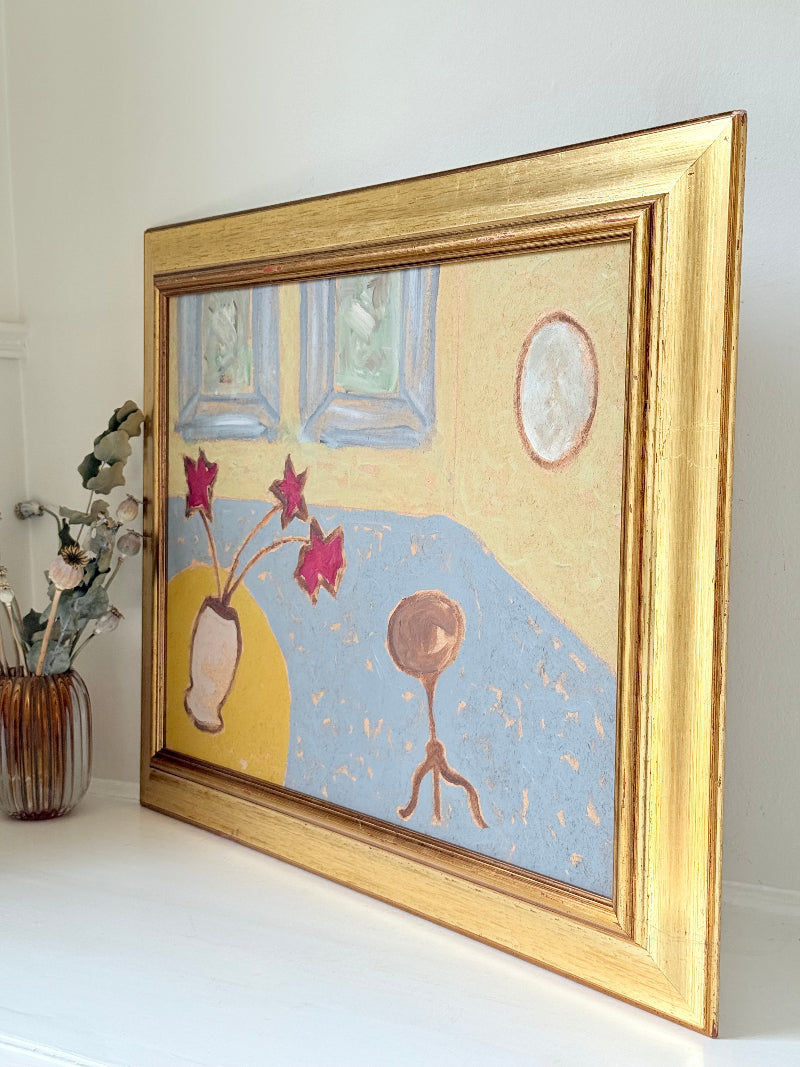 Naïve interior oil painting with red flowers in a vase, in golden frame, styled on a white dresser with neutral background
