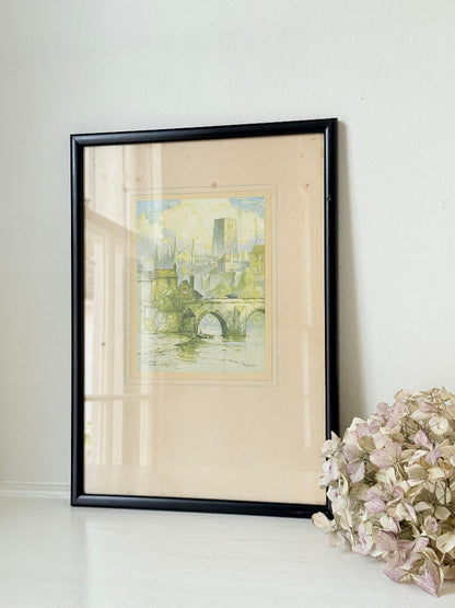 framed print of durham cathedral and elvet bridge with soft green and yellow tones photographed on white surface
