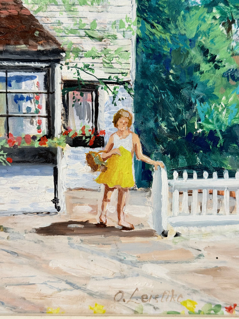 Oil on board painting of a girl in a yellow dress outside a cottage with picket fence, framed, photographed on a white surface
