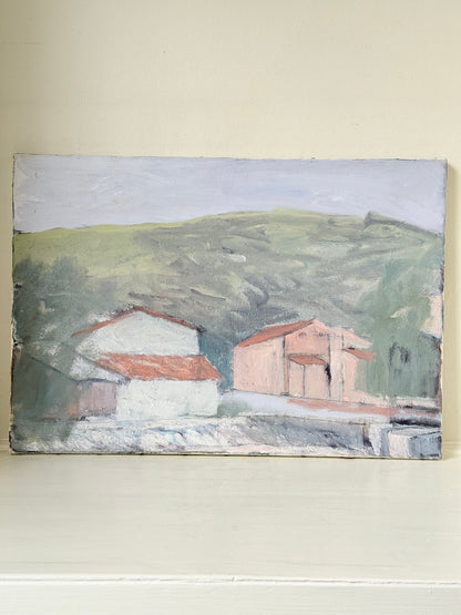Unframed vintage oil painting of hillside cottages with terracotta roofs, green landscape, and textured brushwork, on white surface.