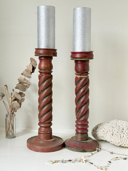 Vintage wooden barley twist candlesticks, a pair with painted finish, photographed on a white surface