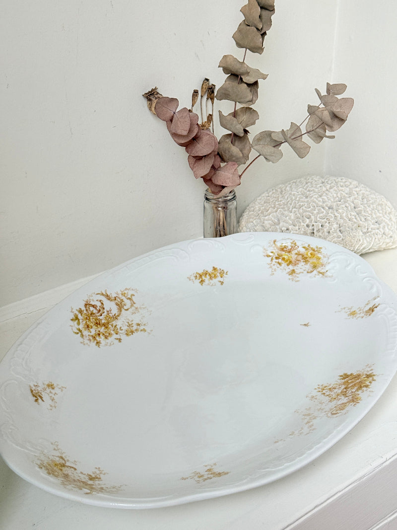 Antique Springer and Co Elbogen Senta porcelain platter in white with floral detail, photographed on a white surface