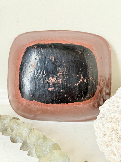 Vintage studio pottery soap dish with hand painted blue bird motif and terracotta rim, photographed on a white surface