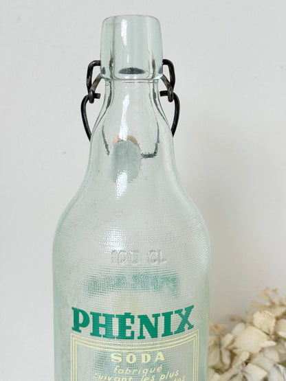 vintage french soda bottle phenix aqua green glass with ceramic swing top 31cm on white surface