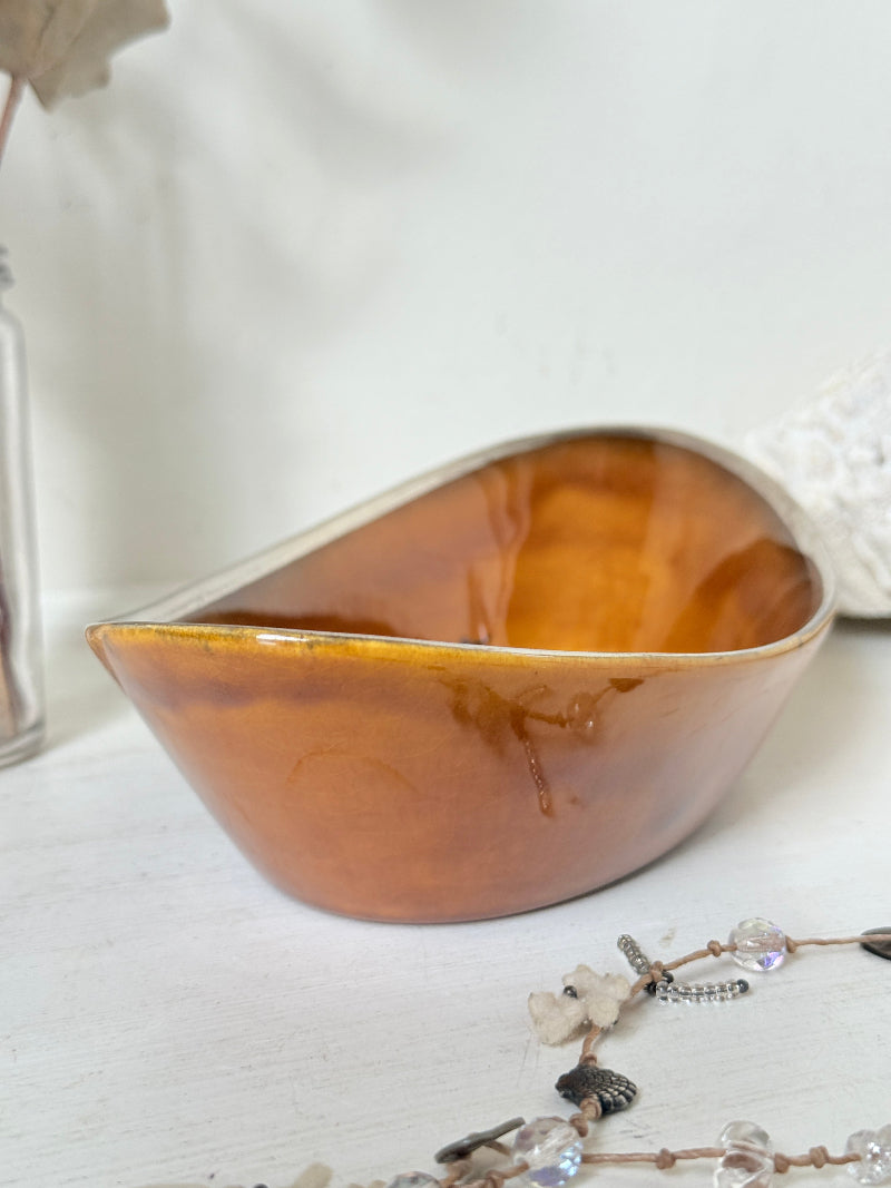 Antique Ridgways stoneware oval dish photographed on a white surface in amber treacle glaze with black Coaching Days and Coaching Ways transfer scene