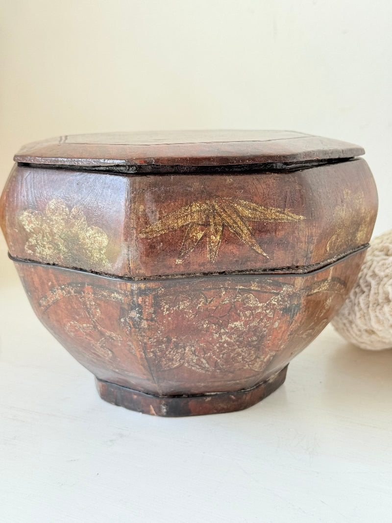 Antique octagonal Chinese lacquer basket with floral decoration and central figure, shown with lid on and off on a white surface

