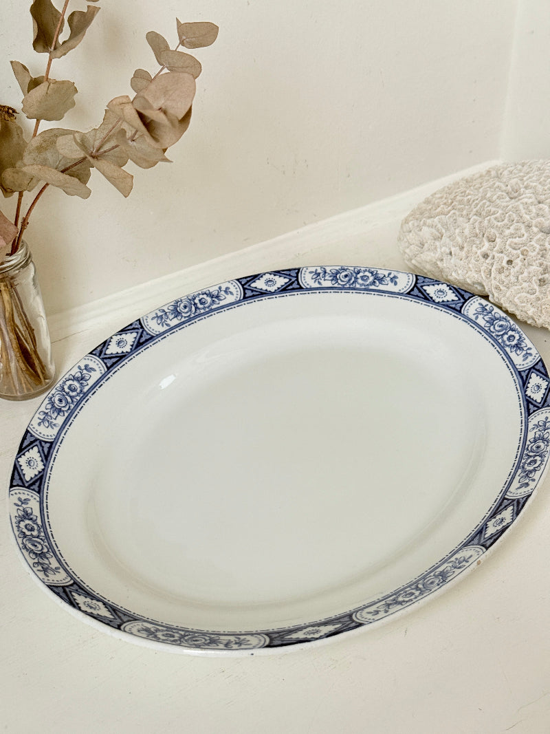 Vintage Burleigh Ware blue and white oval serving platter photographed on a white surface