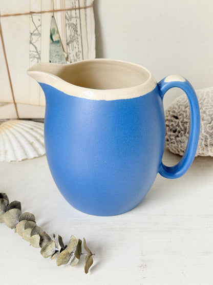 Vintage cornflower blue glazed stoneware jug with cream interior, pulled spout and curved handle for kitchen styling