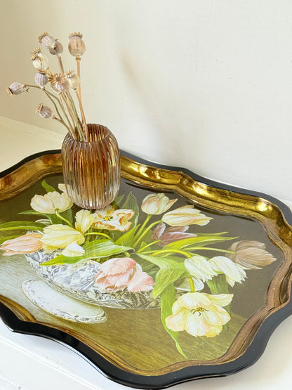 Large vintage printed tulip tray with scalloped edge and black lacquered finish, photographed on white surface.