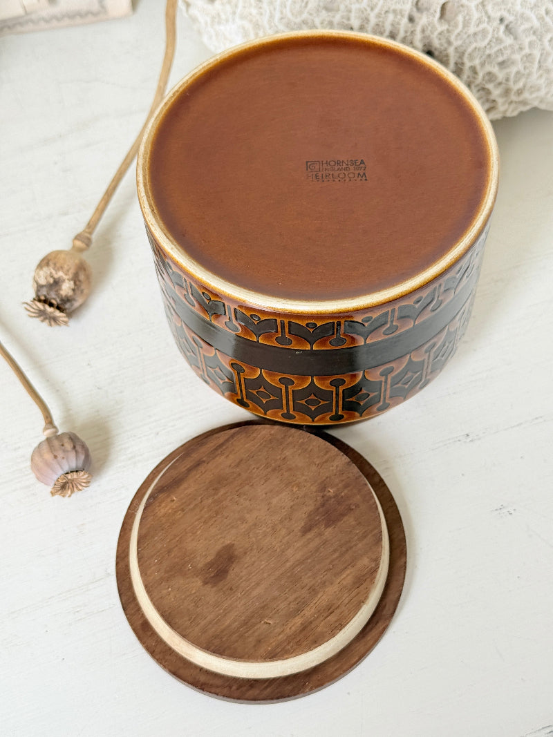 Hornsea Heirloom tea storage jar in autumn brown stoneware with teak lid photographed on a white surface