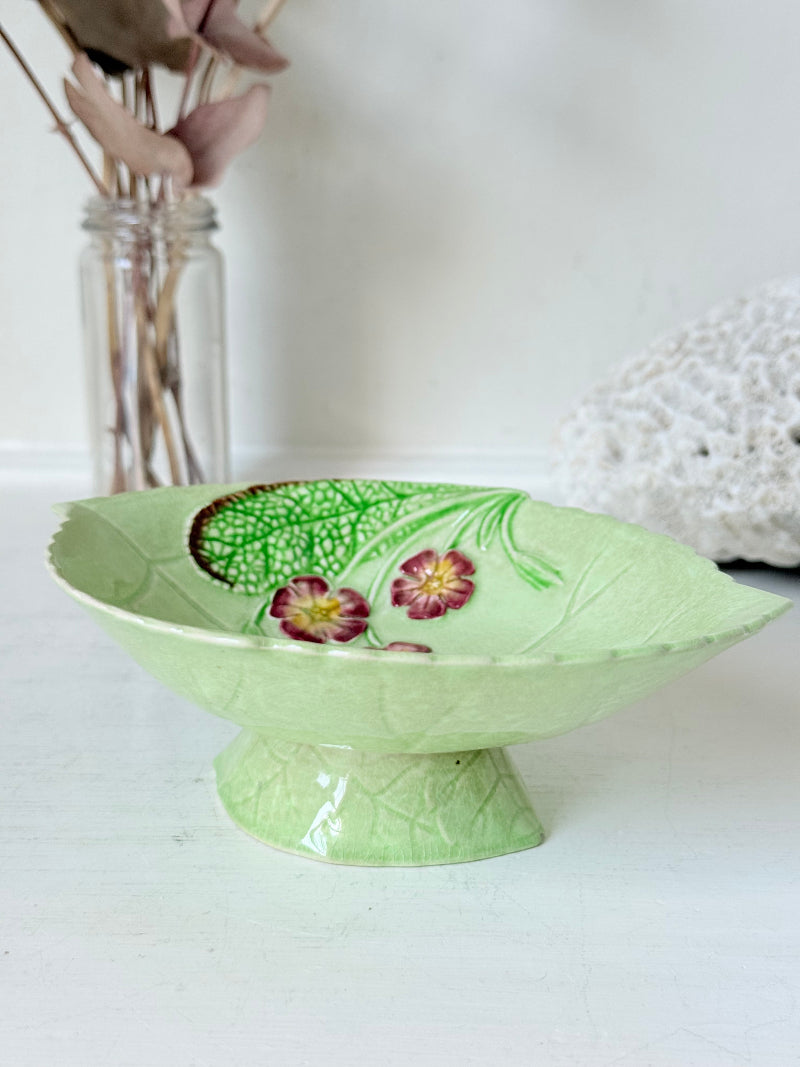 Vintage Carlton Ware green leaf pedestal dish with pansy decoration, photographed on a white surface