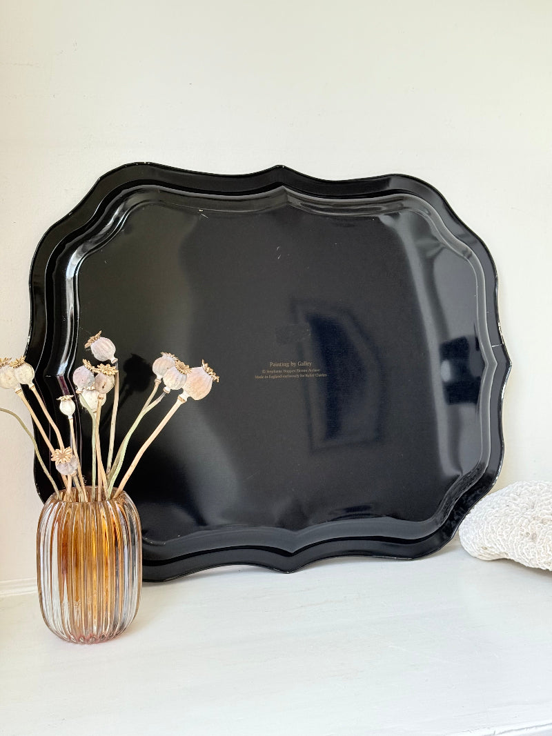 Large vintage printed tulip tray with scalloped edge and black lacquered finish, photographed on white surface.