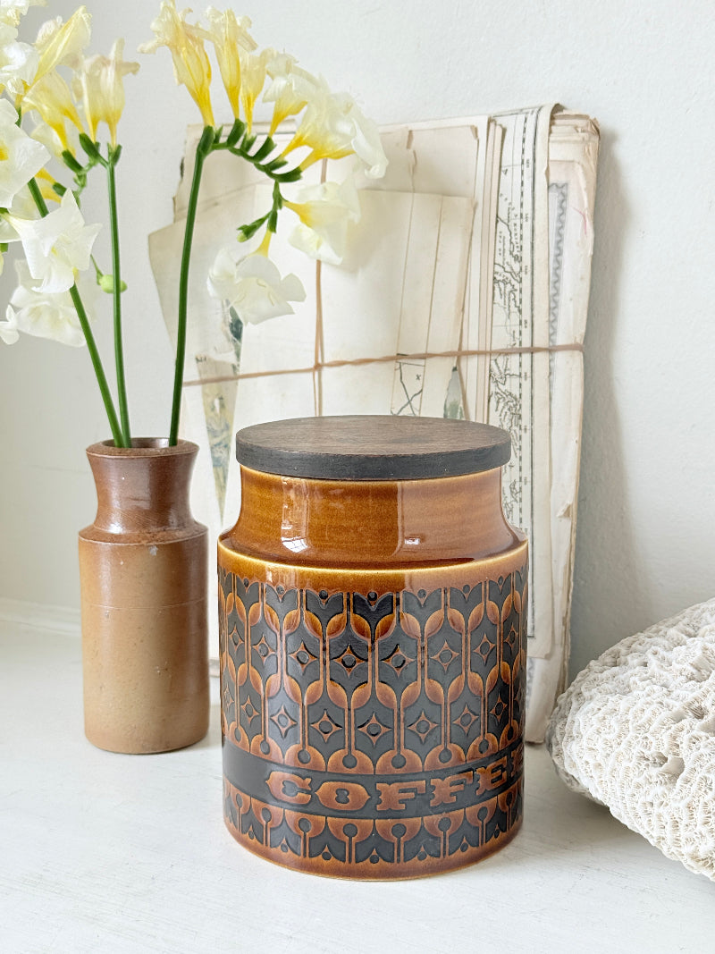 Hornsea Heirloom coffee storage jar in autumn brown stoneware with teak lid photographed on a white surface
