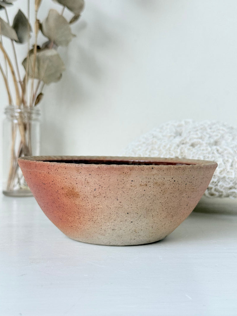 Benjamin Eeles studio pottery stoneware bowl with green and blue glazed interior on a white surface.
