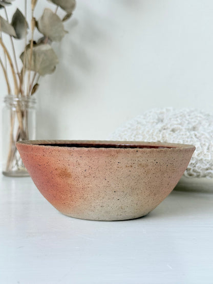 Benjamin Eeles studio pottery stoneware bowl with green and blue glazed interior on a white surface.