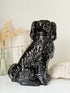 Vintage Staffordshire style black ceramic spaniel dog with gold lustre collar, glossy glaze and textured coat detail