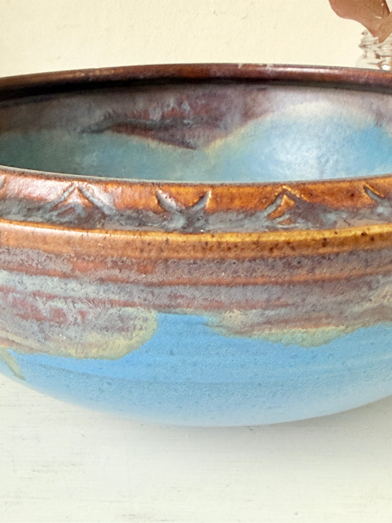 Vintage Bourne Denby stoneware fruit bowl in blue and brown glaze, photographed on a white surface