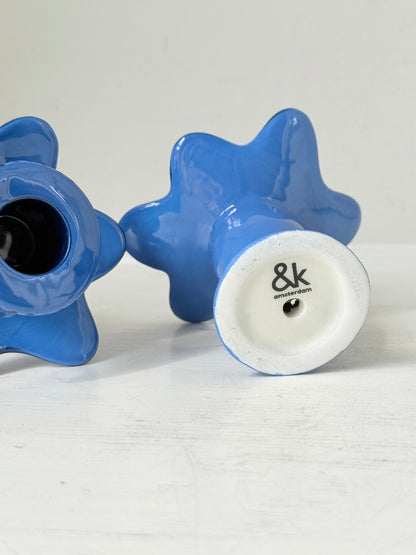 Pair of &amp;Klevering Amsterdam cobalt blue ceramic candle holders with hand painted detail and pink taper candles