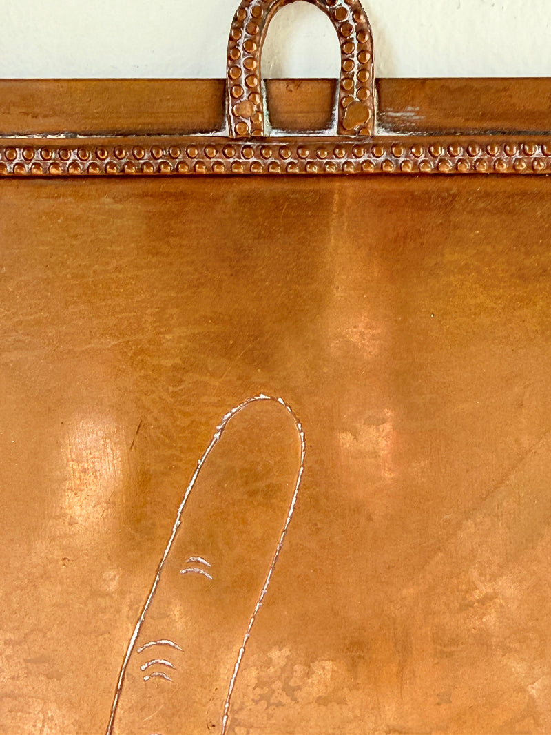 Vintage hanging copper pipe stand with hand etched design, ideal for holding utensils, tools or dog leads, photographed on a white surface beside dried stems.