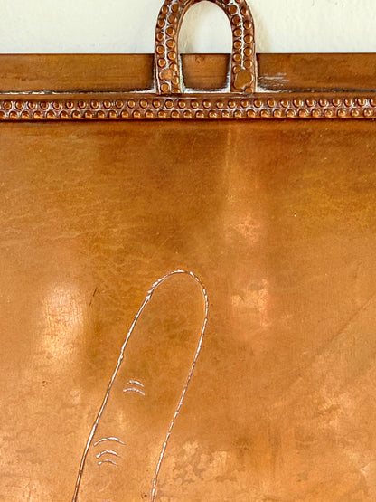 Vintage hanging copper pipe stand with hand etched design, ideal for holding utensils, tools or dog leads, photographed on a white surface beside dried stems.