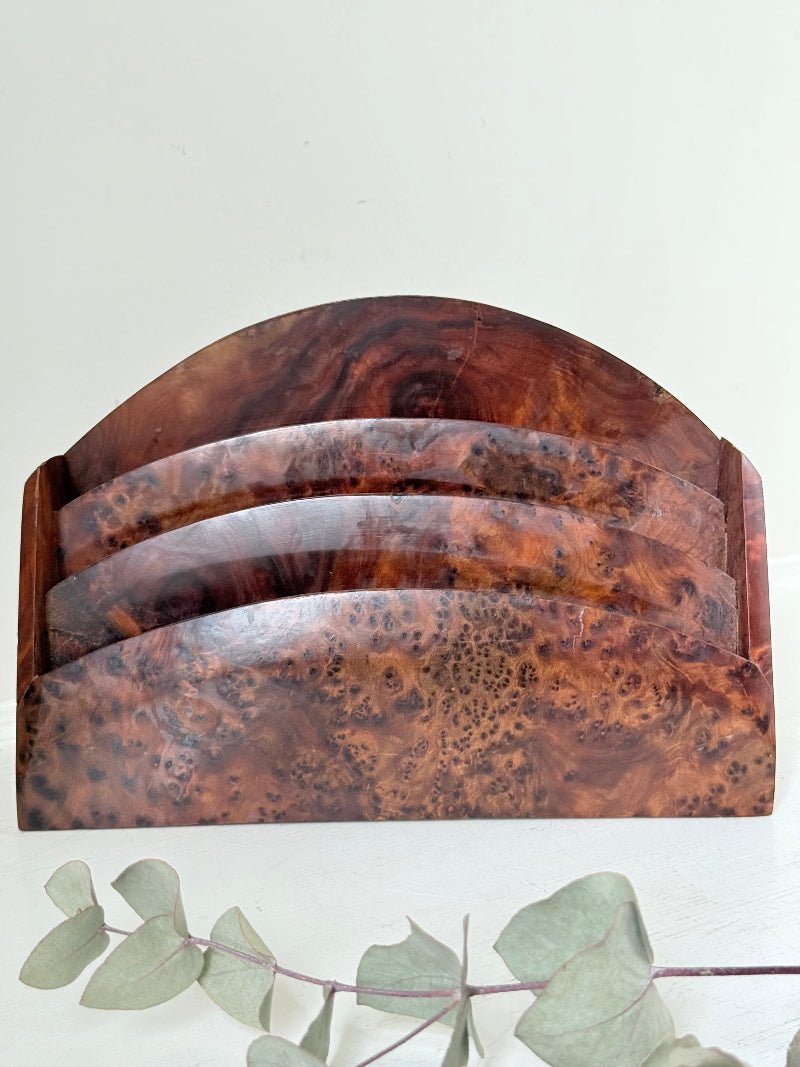 Three-slot curved letter rack made from polished burl wood with rich swirling grain, mid-century style desk organiser.