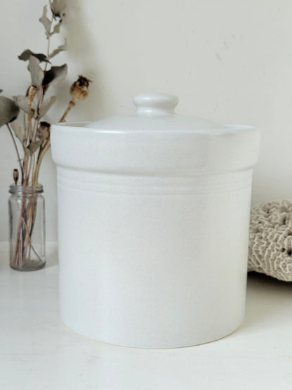 Pfaltzgraff Yorktowne stoneware flour pot with blue floral motif and lid, photographed on a white surface