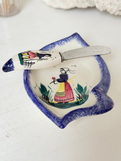 Vintage Quimper butter dish with ceramic knife, hand painted Breton figure, photographed on a white surface