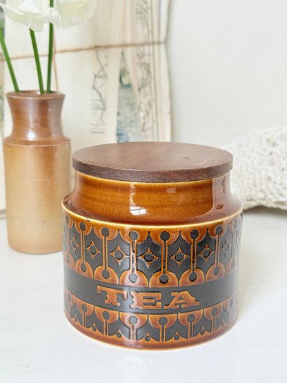 Hornsea Heirloom tea storage jar in autumn brown stoneware with teak lid photographed on a white surface