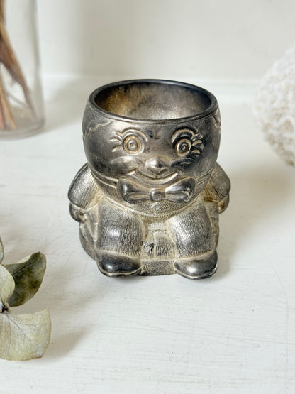 Vintage Humpty Dumpty silver plate egg cup, photographed on a white surface