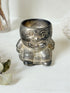 Vintage Humpty Dumpty silver plate egg cup, photographed on a white surface