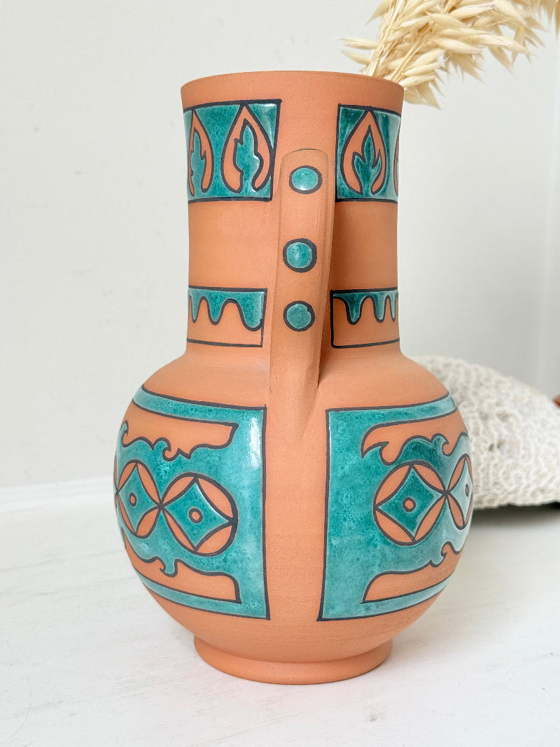 Spanish folk pottery twin handled jug vase in terracotta with turquoise glaze and Andalusian style decoration