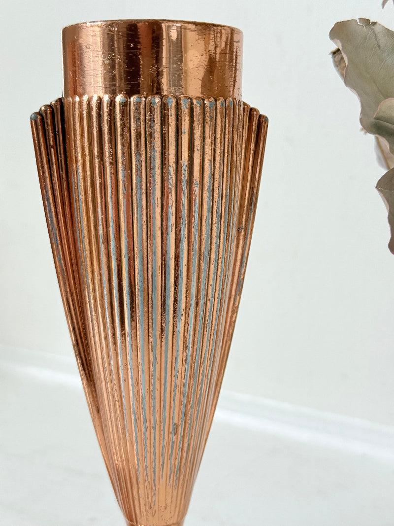 Pair of vintage copper Art Deco vases with fluted surface, photographed on a white background.