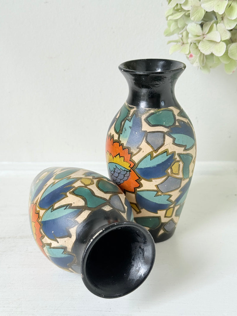 Pair of hand painted Brentleigh Ware Art Deco stoneware vases with bold floral design, photographed on a white surface