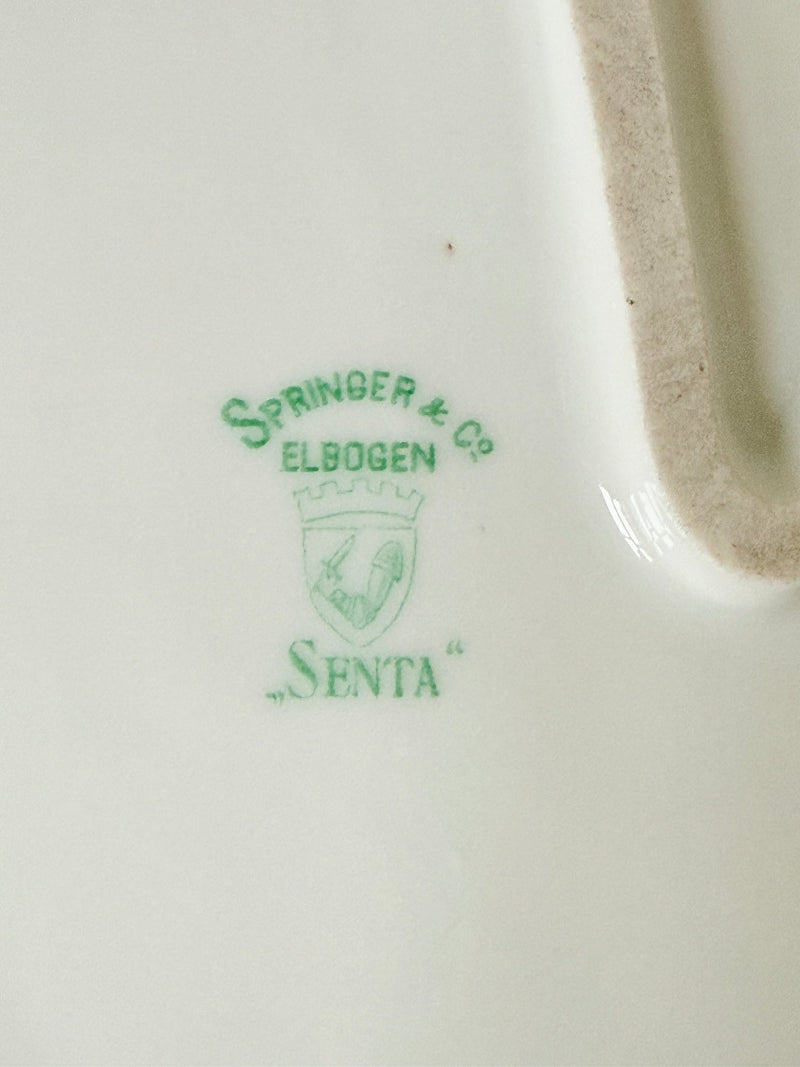 Antique Springer and Co Elbogen Senta porcelain platter in white with floral detail, photographed on a white surface