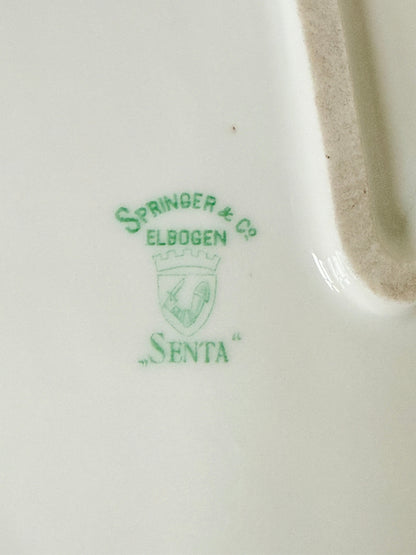 Antique Springer and Co Elbogen Senta porcelain platter in white with floral detail, photographed on a white surface