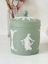 Vintage Wedgwood Jasperware sage green lidded jar with ball finial, decorated with white Dancing Hours neoclassical figures, styled with dried stems.
