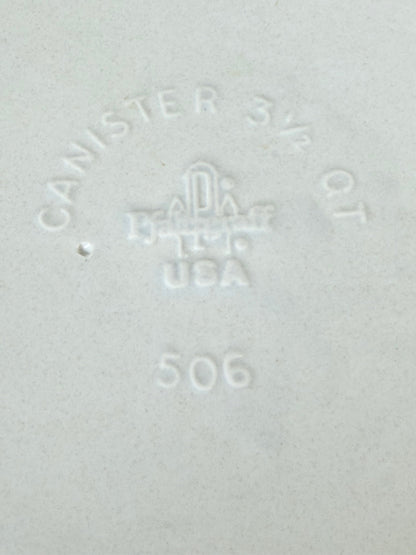 Pfaltzgraff Yorktowne stoneware flour pot with blue floral motif and lid, photographed on a white surface