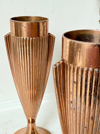 Pair of vintage copper Art Deco vases with fluted surface, photographed on a white background.