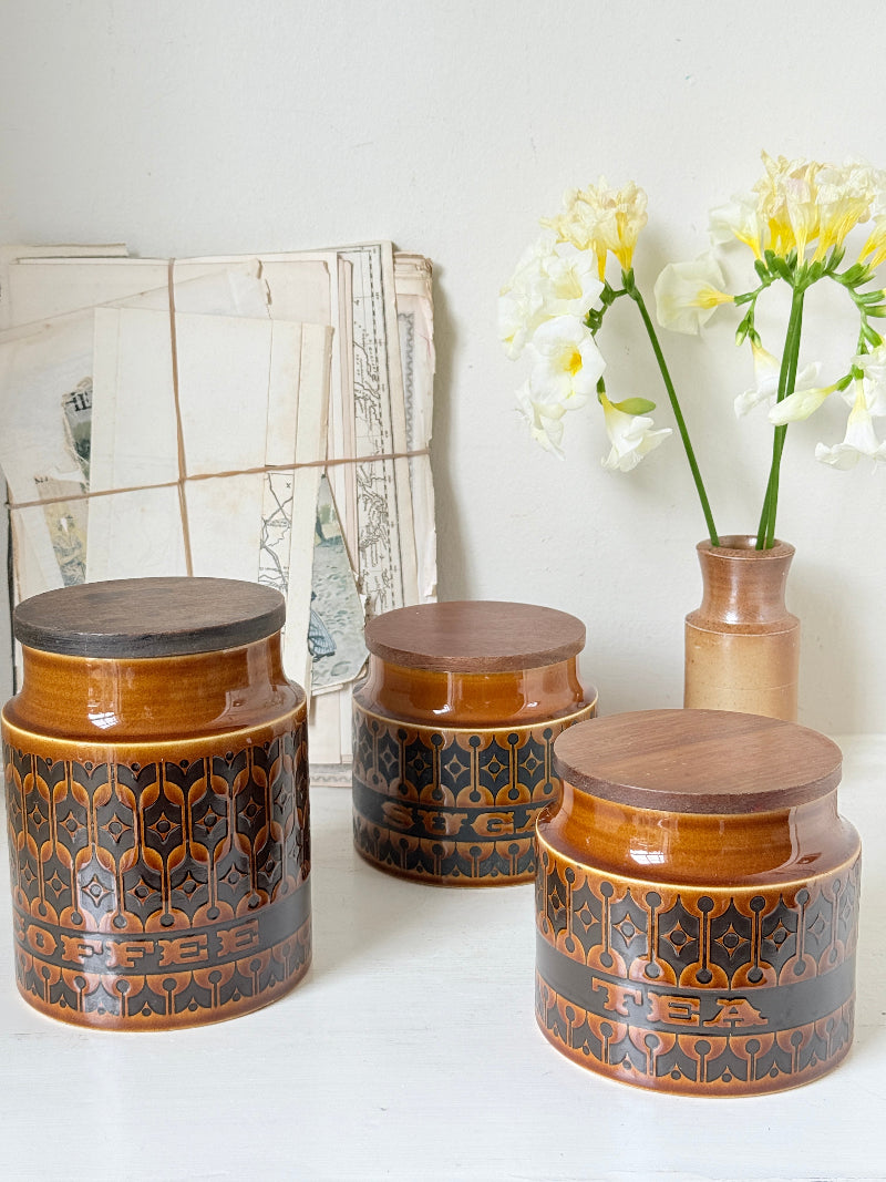 Hornsea Heirloom coffee tea and sugar canister set in autumn brown stoneware with teak lids photographed on a white surface