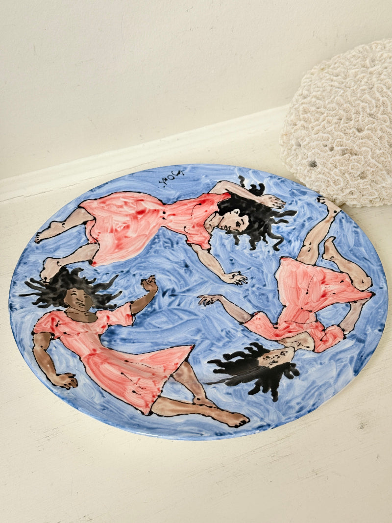 Signed Cary Outis studio art ceramic plate with figurative swimmers, blue painted ground and original Little Ouse artist label
