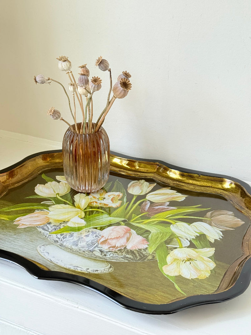 Large vintage printed tulip tray with scalloped edge and black lacquered finish, photographed on white surface.
