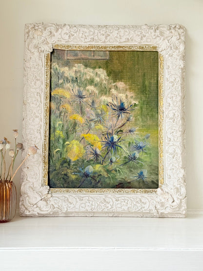 Framed floral oil painting on board by Muriel Hester Broughton, 1970, shown on a white surface with decorative carved frame