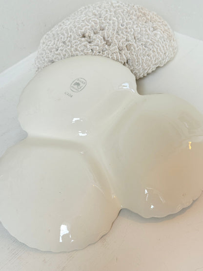 Poole Pottery triple scallop hors d’oeuvre dish in grey glaze with powder blue handle photographed on a white surface