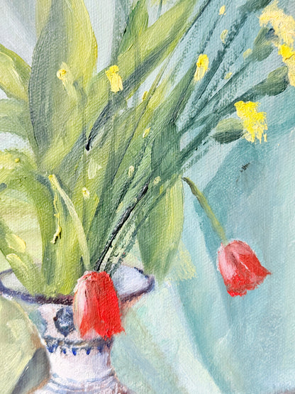 Watercolor painting of tulips in a vase, featuring green leaves, yellow blossoms, and two red tulips against a light blue-green background.