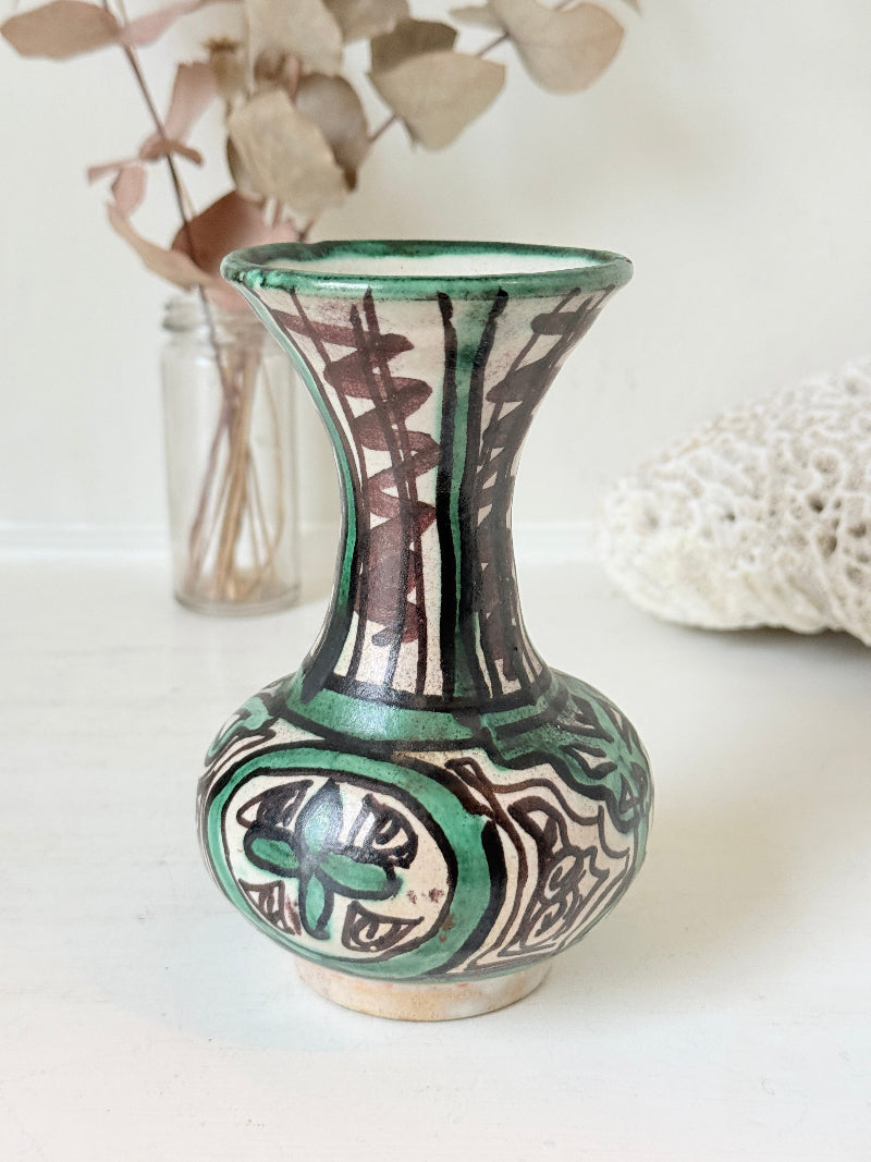 Domingo Punter Teruel studio pottery vase in green and black glaze photographed on a white surface